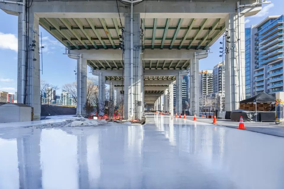 Skating rink under freeway in Bentway park in Toronto, Canada.